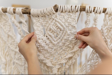 person-using-macrame-technique-home.jpg